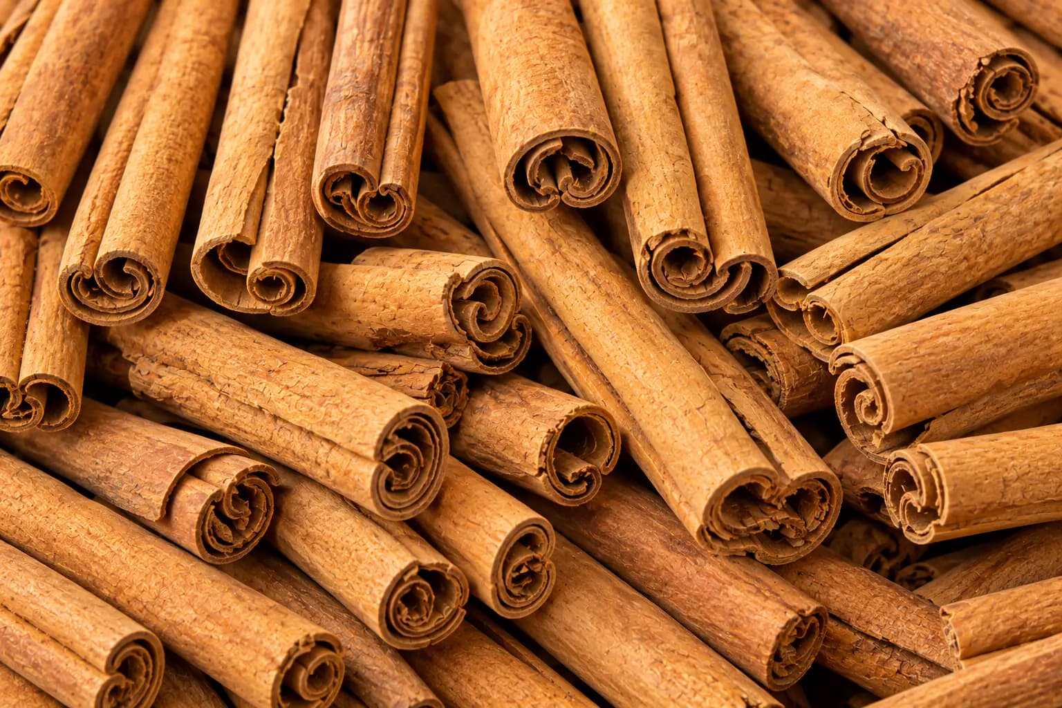 Close-up of stacked cinnamon quills