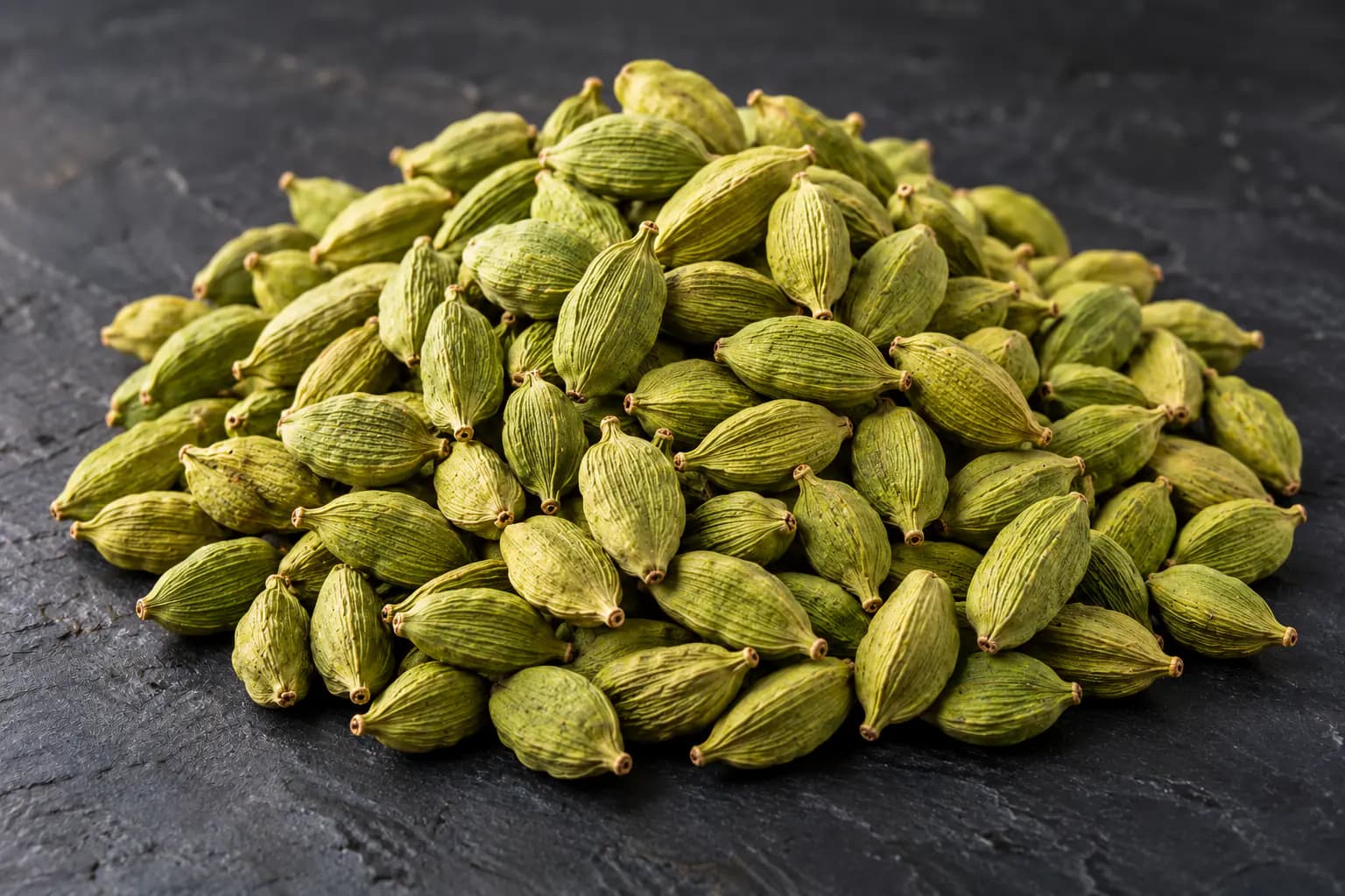 Heap of bold green cardamom pods from Kerala